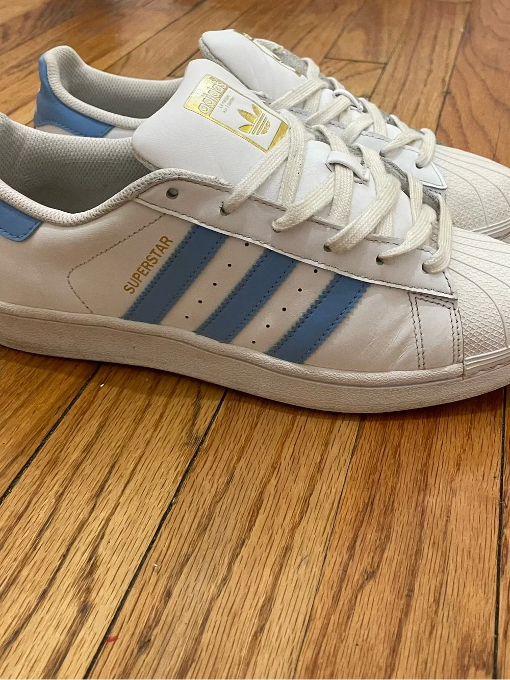 adidas Superstar Men’s Sneakers in White with Light Blue Stripes